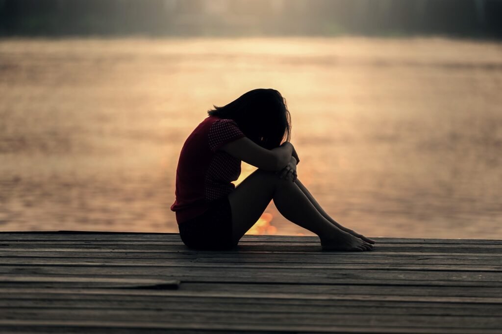 girl, sitting, jetty, docks, nature, boardwalk, young woman, female, sad girl, sad, alone, lonely, solitude, solitary, outdoors, sea, peaceful, silhouette, sunrise, sunset, teenager, water, woman